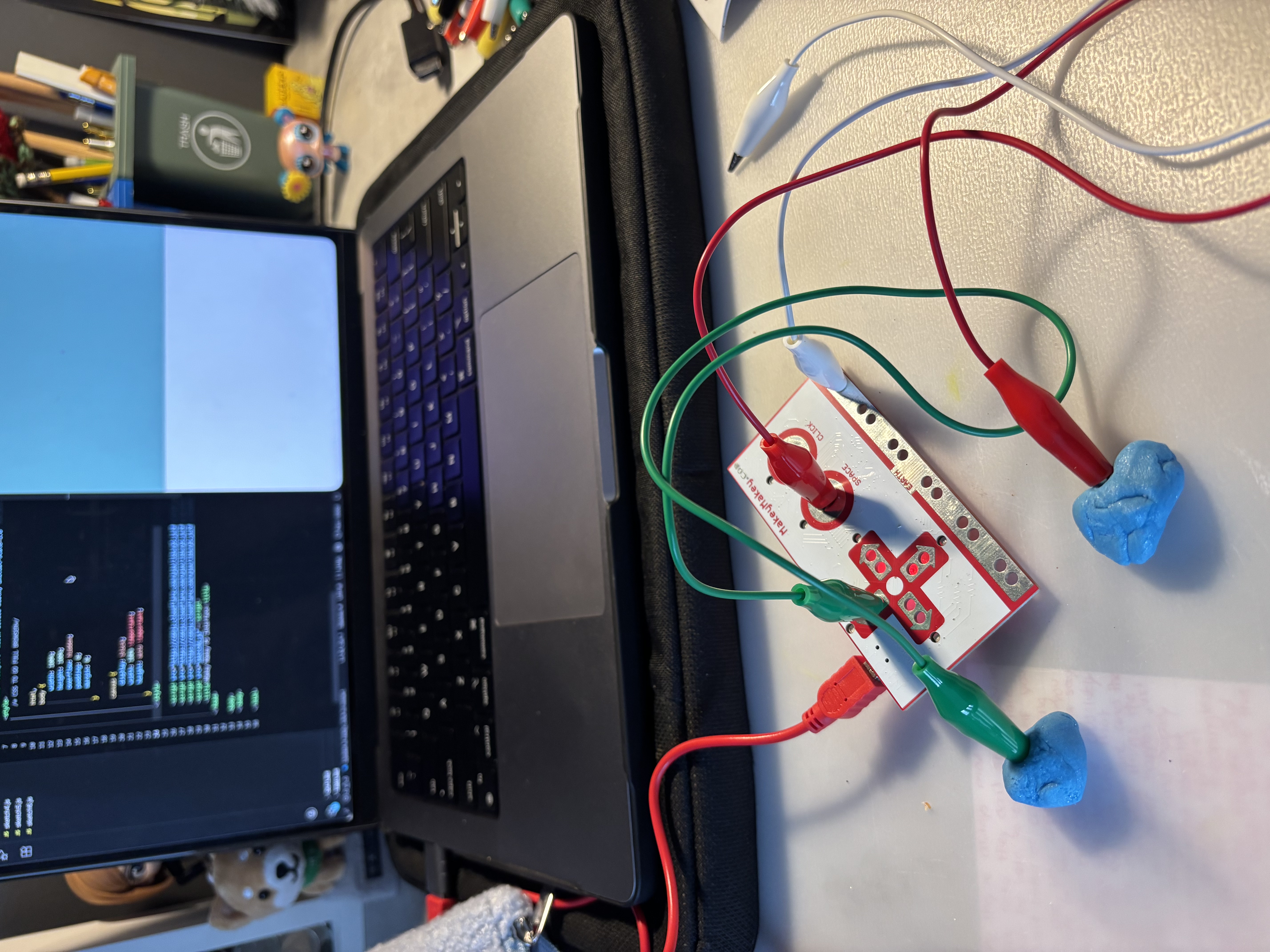 Testing the conductivity of Play-Doh pieces with the Makey Makey as controls.